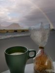 The apartments and rooms at Kirkjufell guesthouse offer an amazing view all day long. Here we enjoyed tea time with biscuits and with a rainbow. :-)